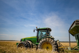 Tractor harvesting farm land