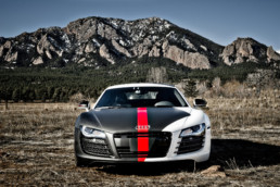 An Audi sports car at the bottom of a mountain